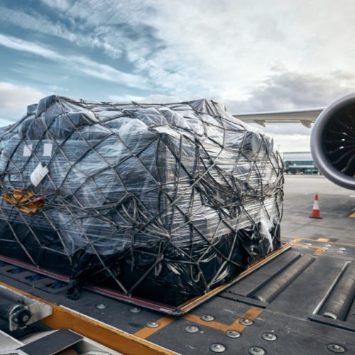 Preparation,Before,Flight.,Loading,Of,Cargo,Container,Against,Airplane.